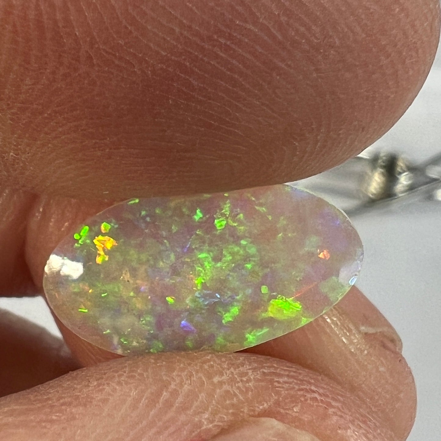 Perfect Lightning Ridge crystal opal displaying magnificent colours. Both sides are polished. Cut by Bill Johnston.