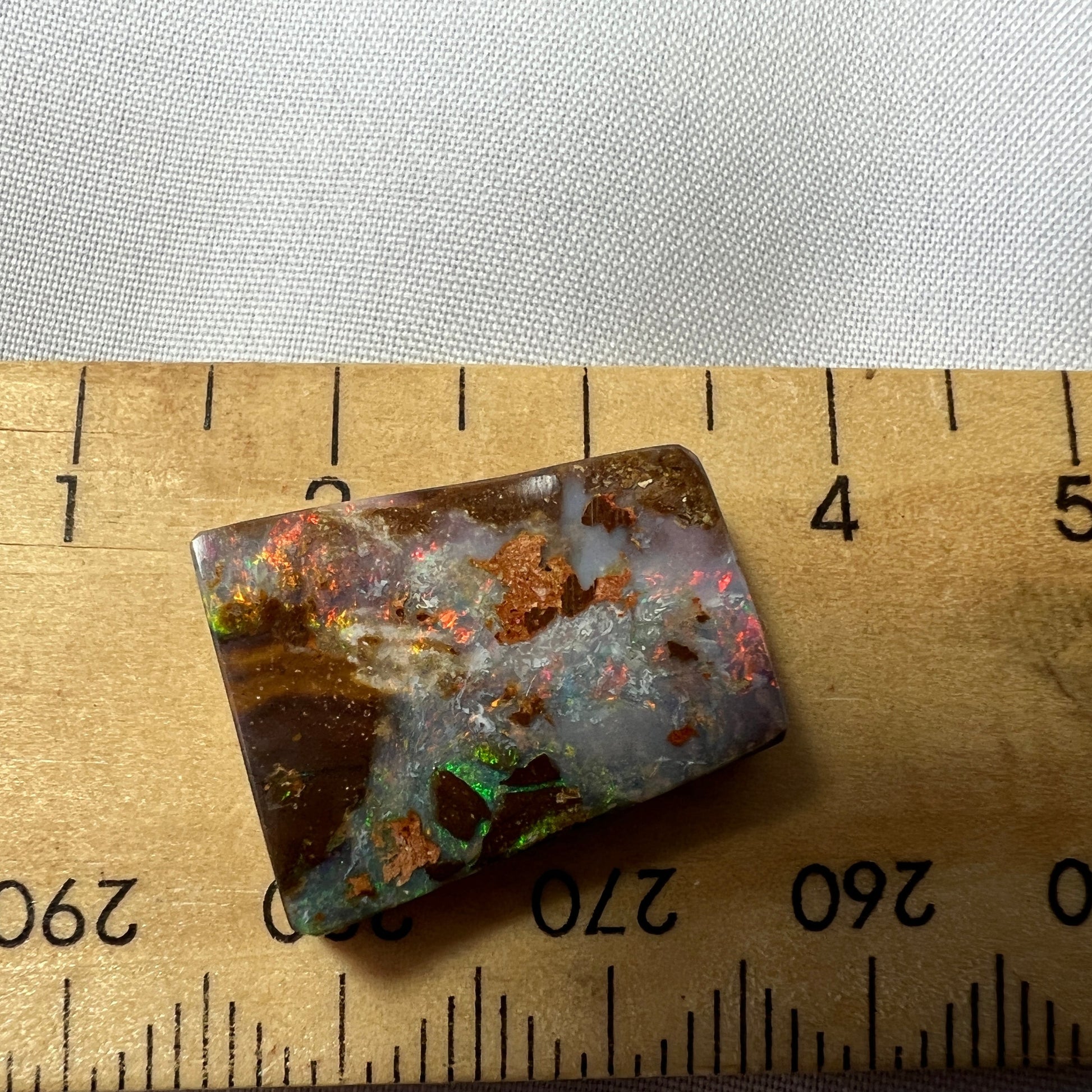 Nice square cut boulder opal from Winton, showing lovely colours.