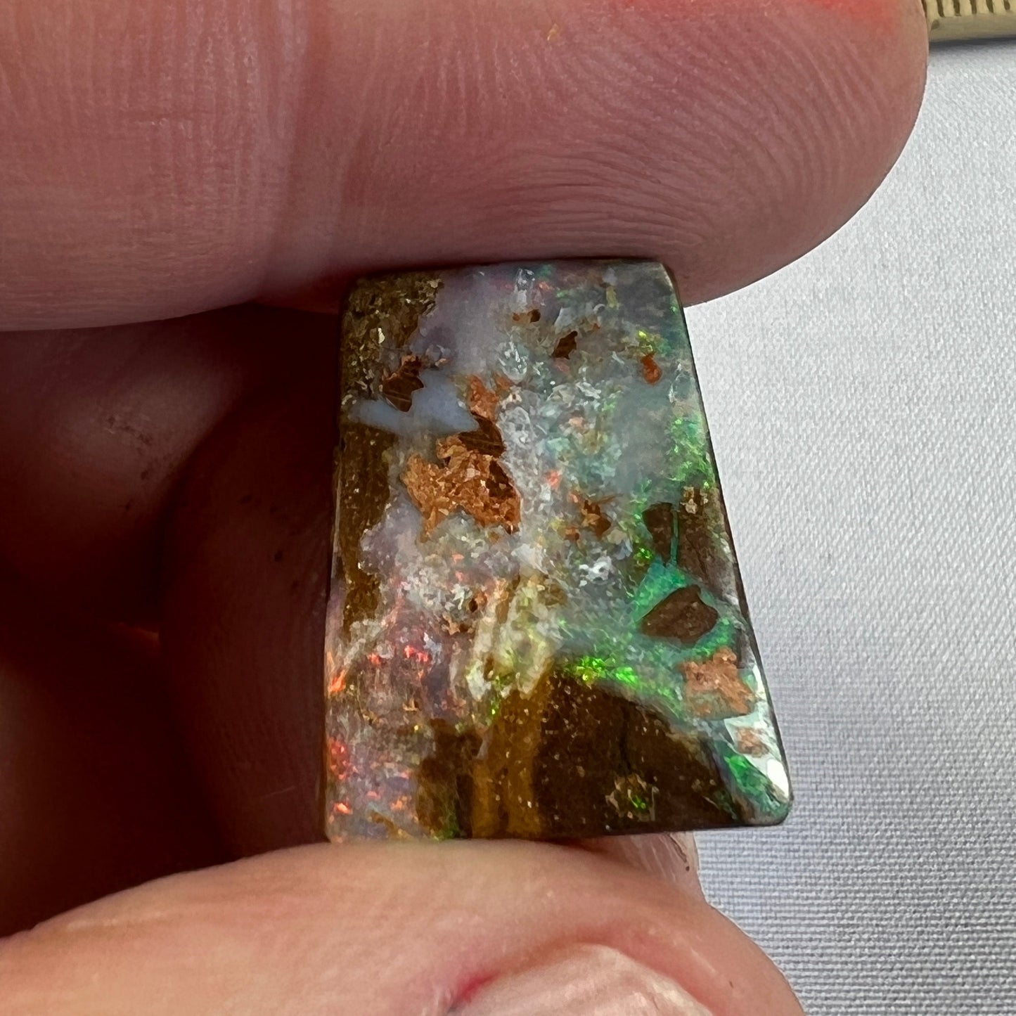 Nice square cut boulder opal from Winton, showing lovely colours.