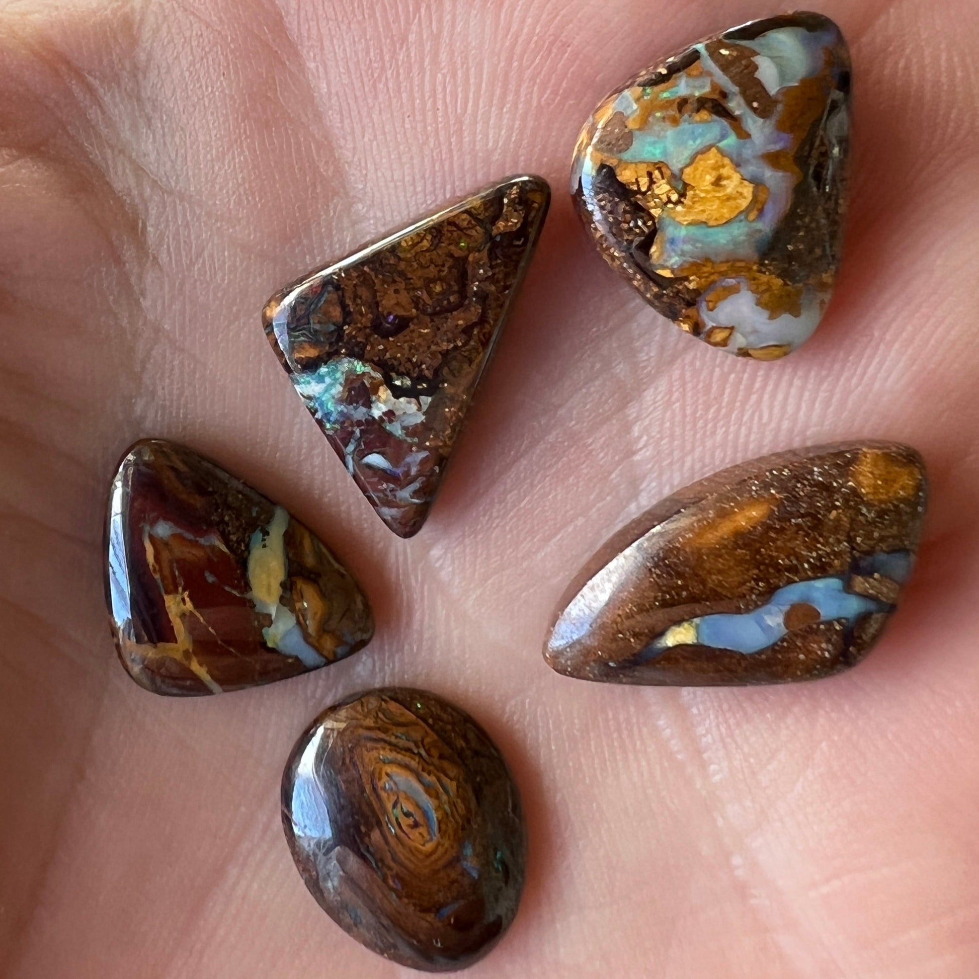 Boulder opal bundle containing 5 beautiful opals from Winton, Queensland. Polished and ready to set.