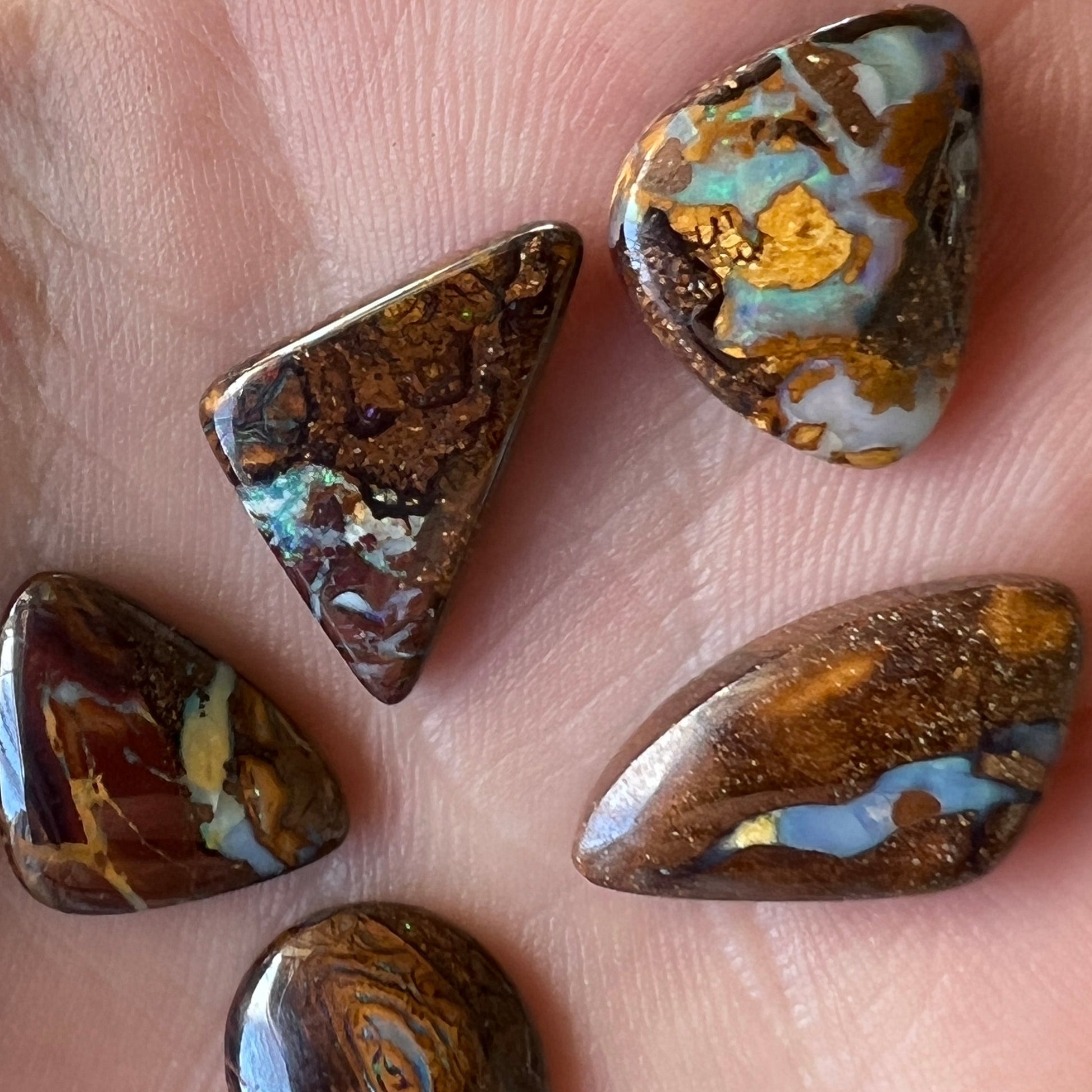 Bundle of four awesome boulder opals from Winton. Polished and ready to set.