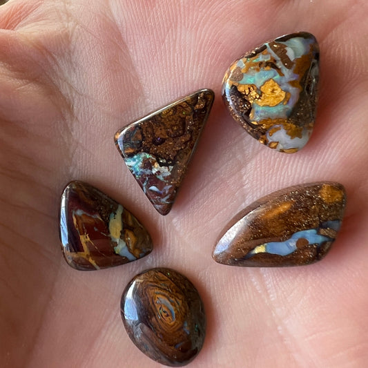 Bundle of four awesome boulder opals from Winton. Polished and ready to set.