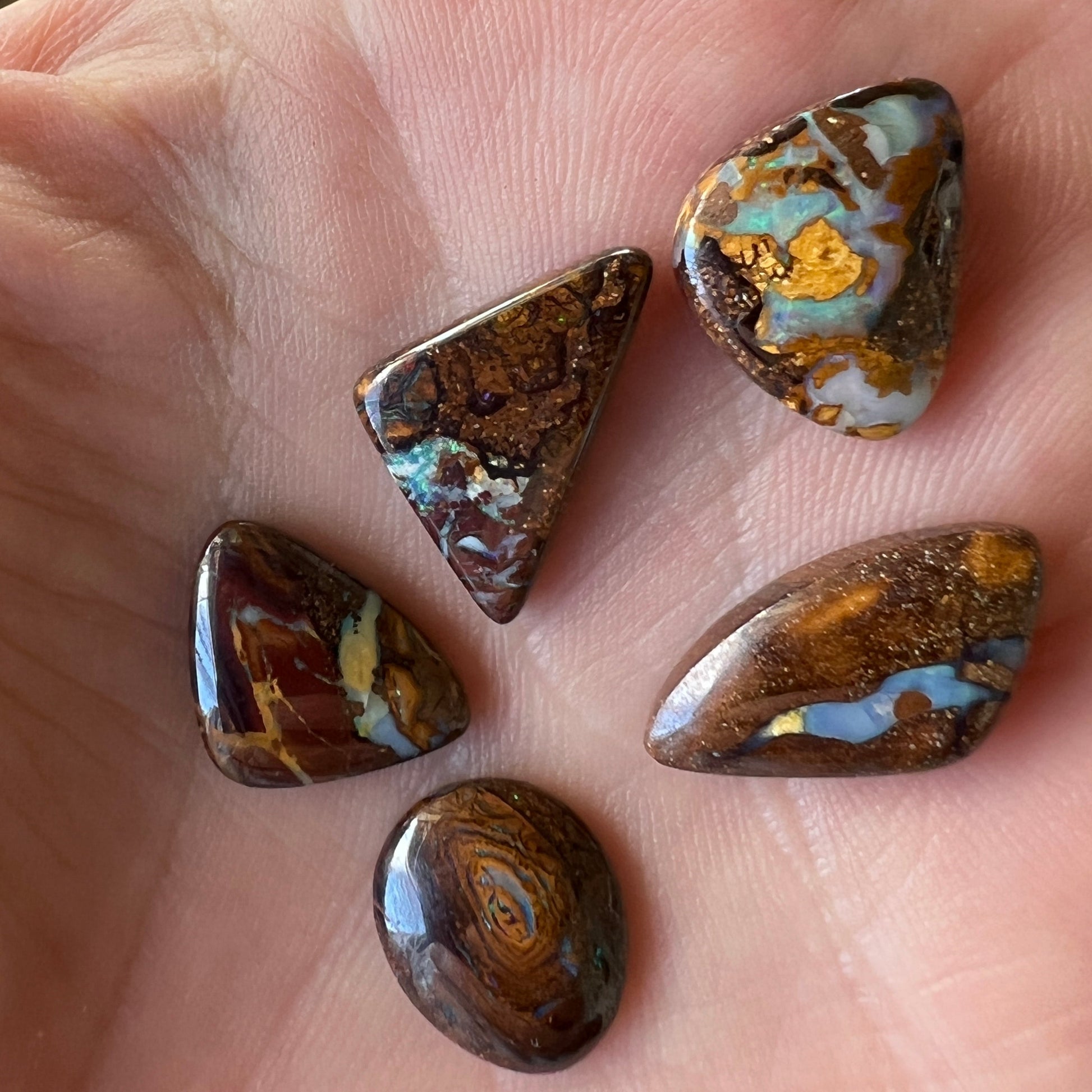 Boulder opal bundle containing 5 beautiful opals from Winton, Queensland. Polished and ready to set.