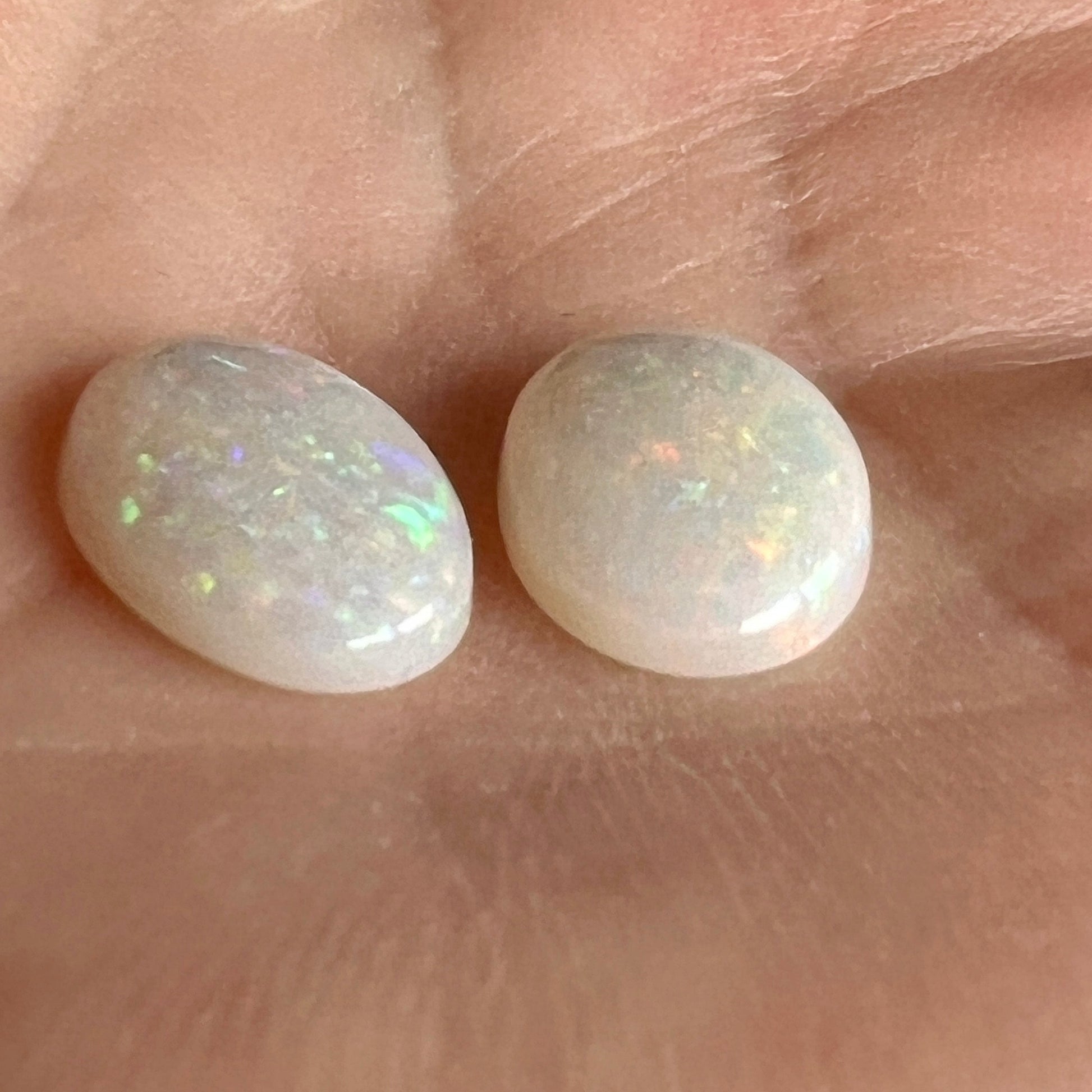 Pair of solid white opals from Coober Pedy. Cabochon cut with pin fire pattern. A matching pair would look great as earrings or anything you want.