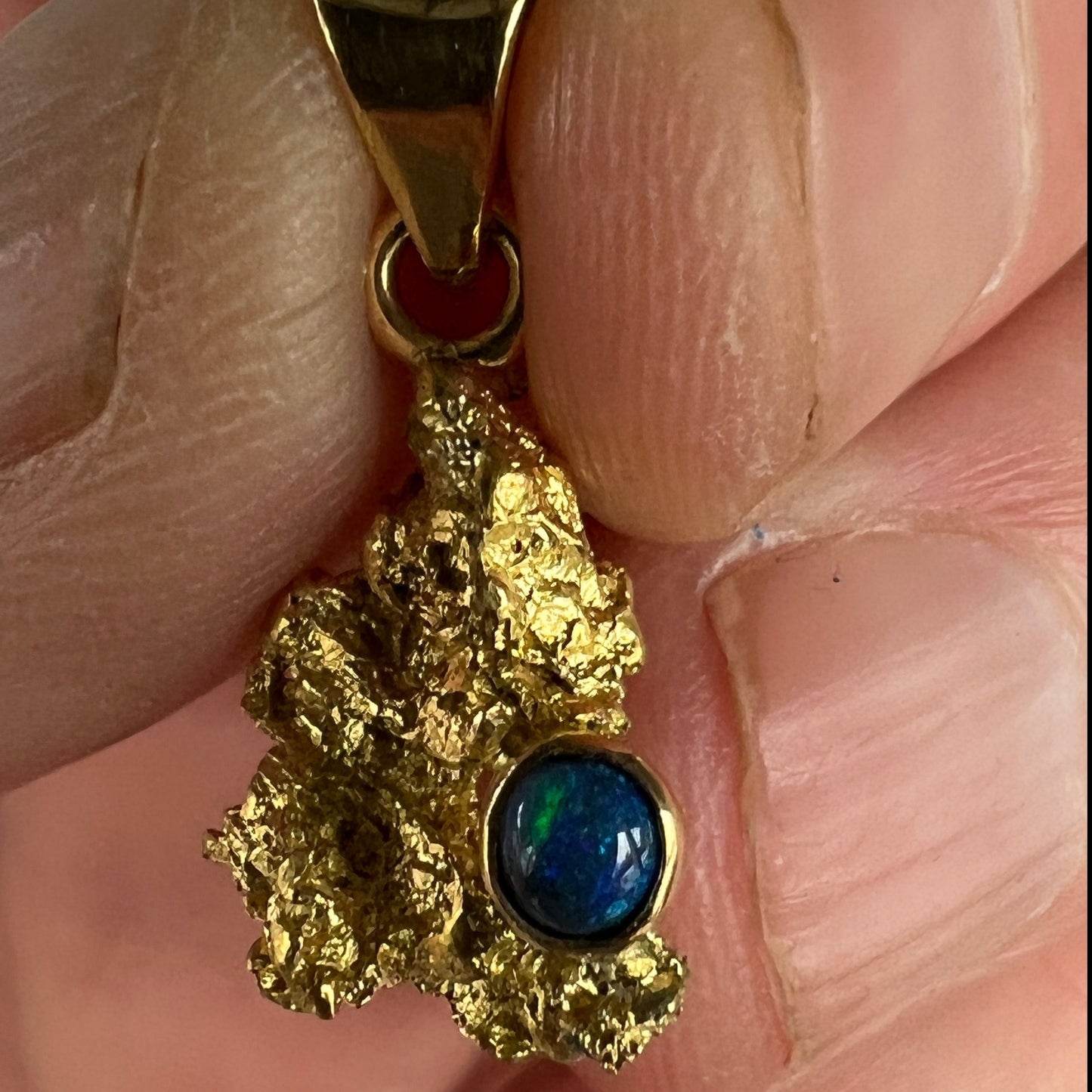 Pure solid gold nugget pendant from Western Australia, with an 18ct gold bale. Set with a beautiful solid black opal from Lightning Ridge.