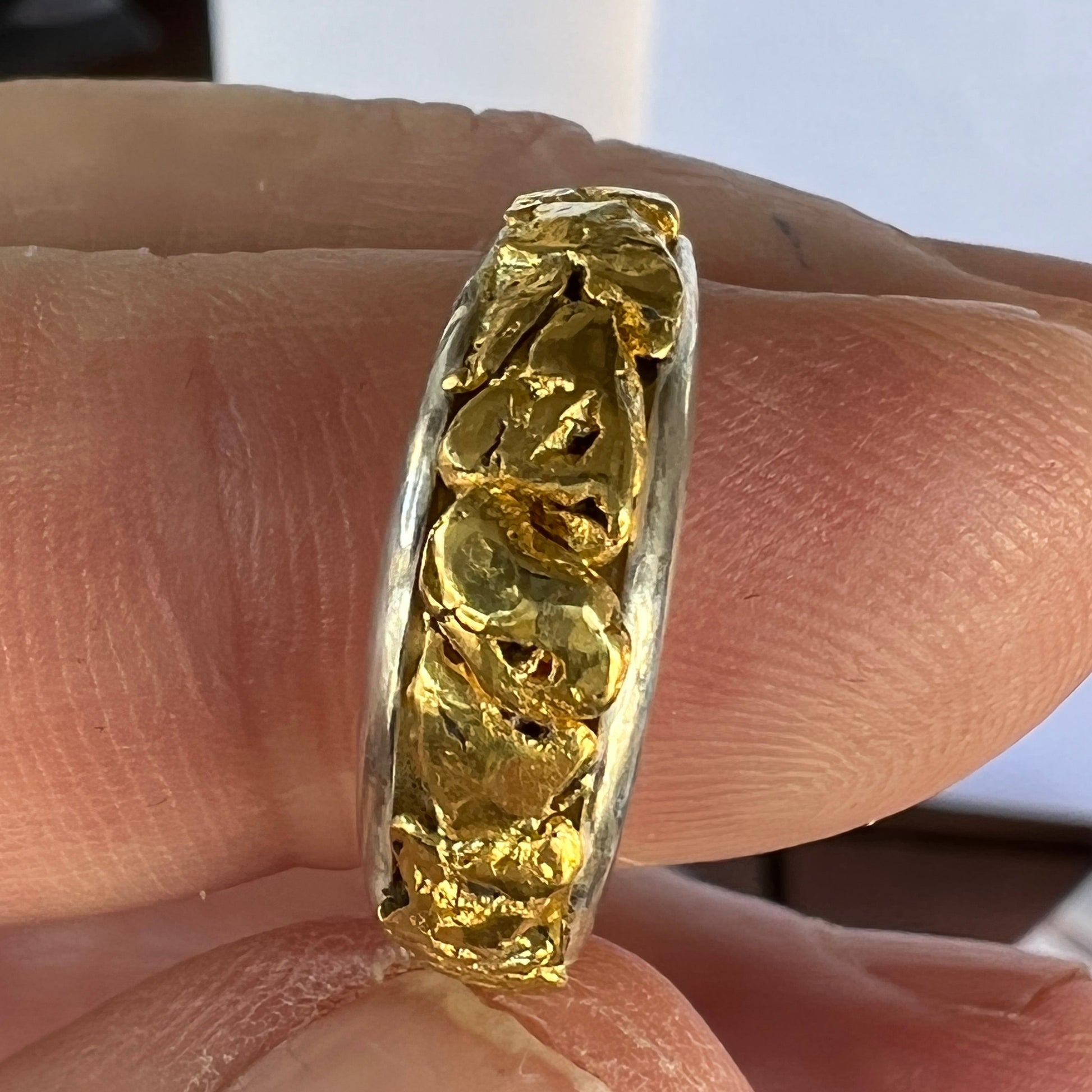 Unique handcrafted ladies ring. Solid silver filled with 2.3 grams of genuine Australian pure gold nuggets from the goldfields of Victoria. 
