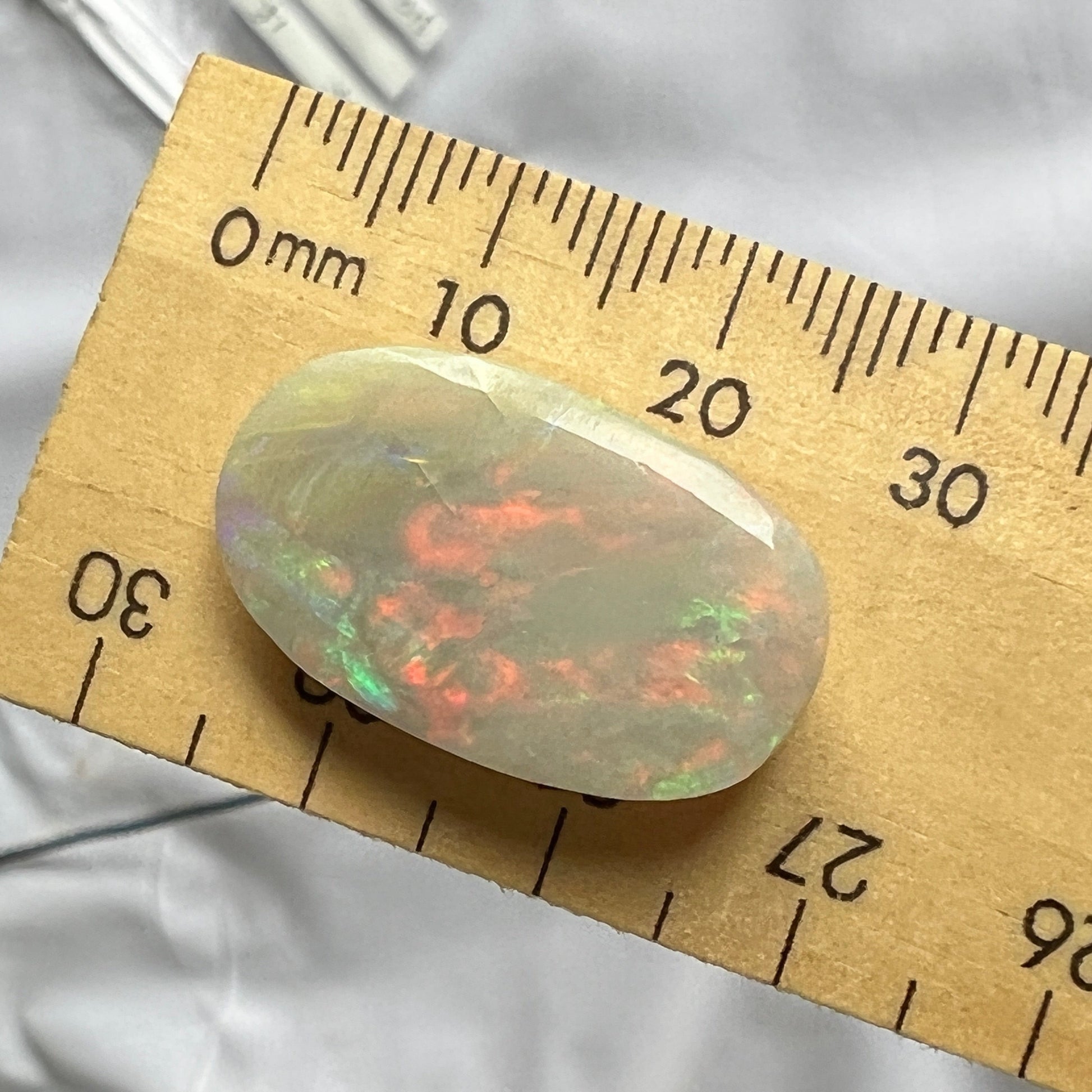 Beautiful large solid opal from Grawin near Lightning Ridge. Great shape and awesome colours.