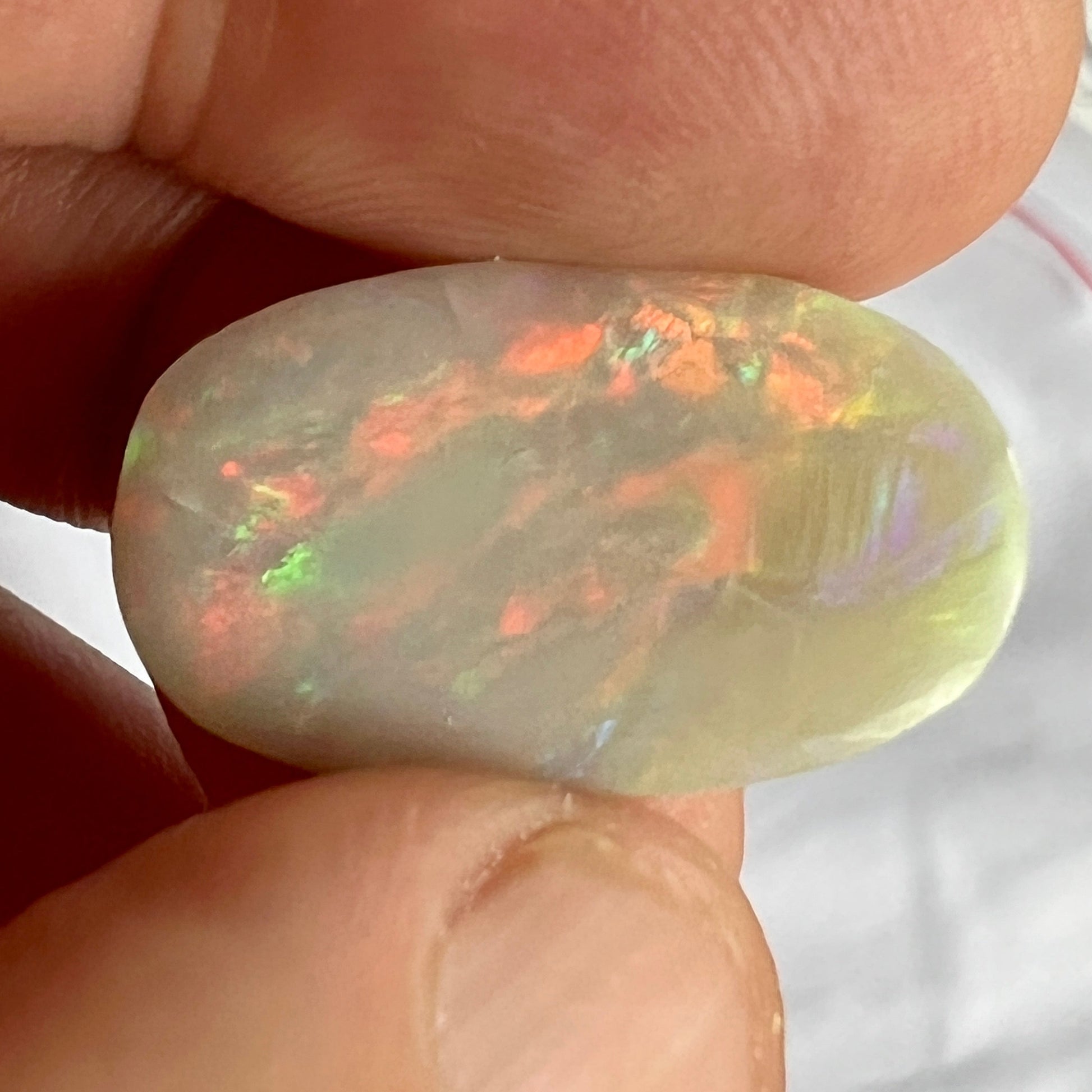 Beautiful large solid opal from Grawin near Lightning Ridge. Great shape and awesome colours. Very small and not noticeable to the eye settled crack, hence price.