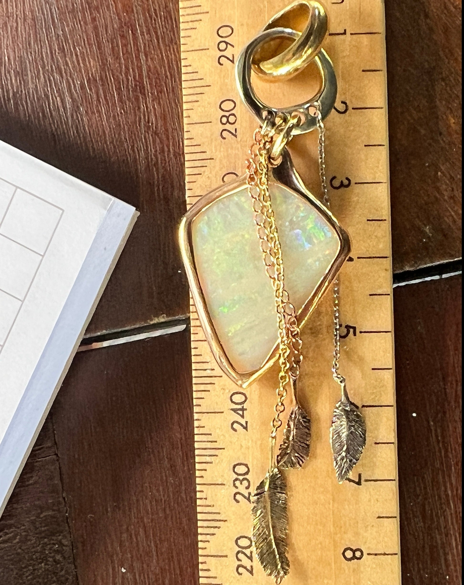 Beautiful solid vertical Mulga from the mine of Craig Haxton in Lightning Ridge. Set in a mixture of 9ct, 18ct, and Platinum gold, beautifully handcrafted by the talented Sally Fisher. A masterpiece.