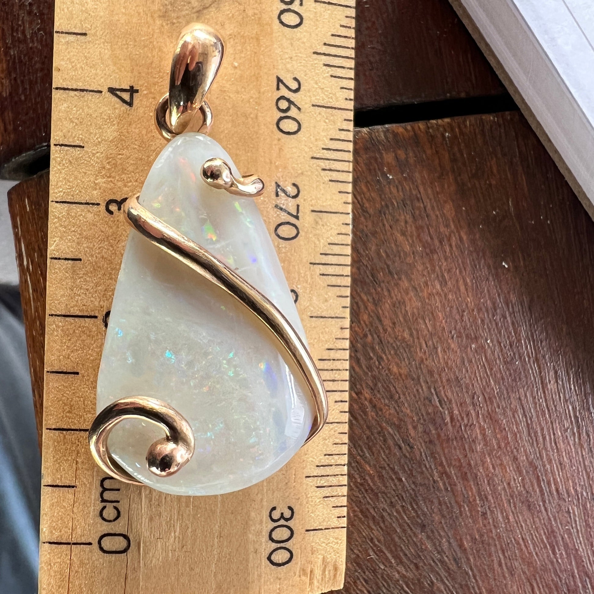 Beautiful solid Australian opal set in a unique 18ct gold design. A beautiful pendant.