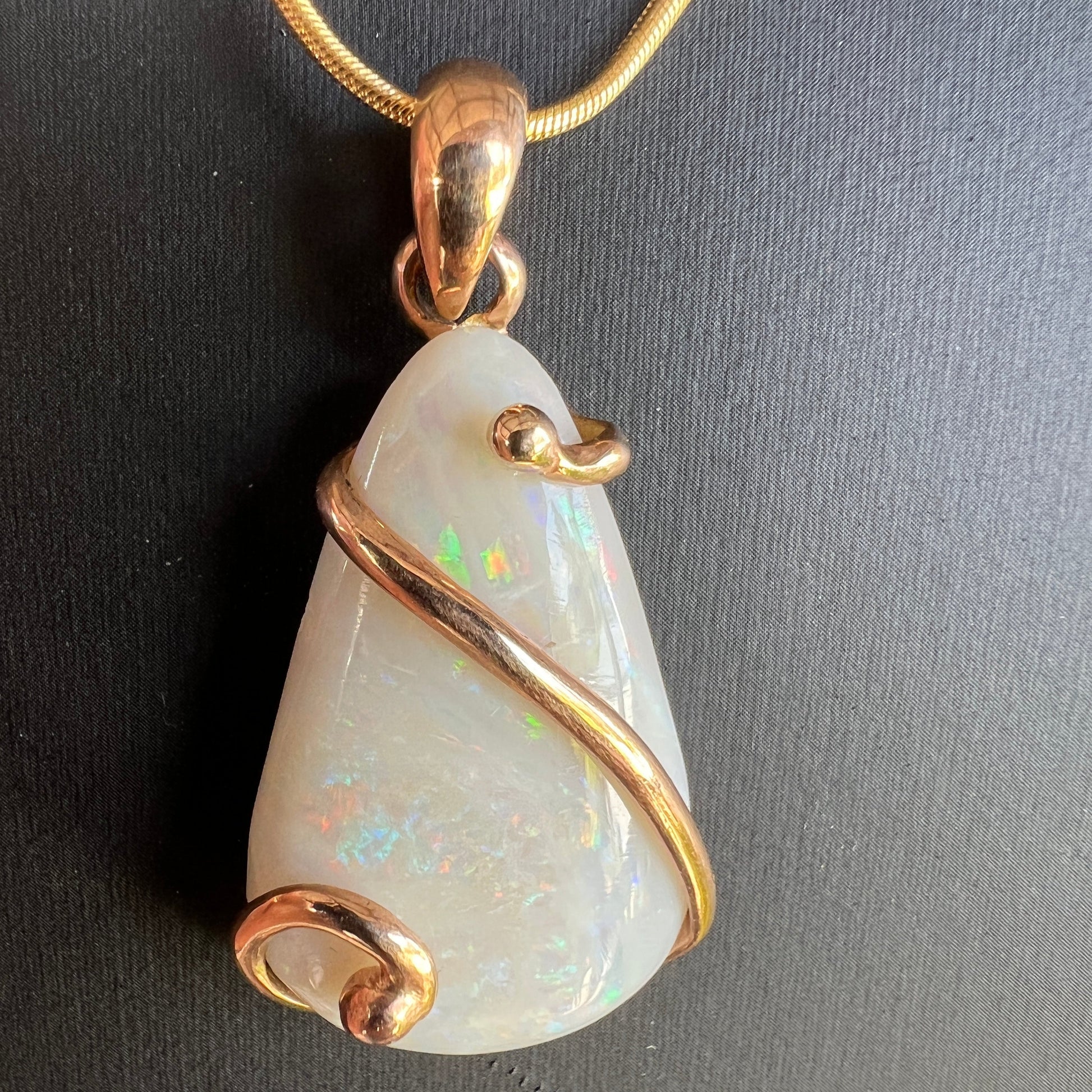 Beautiful solid Australian opal set in a unique 18ct gold design. A beautiful pendant.