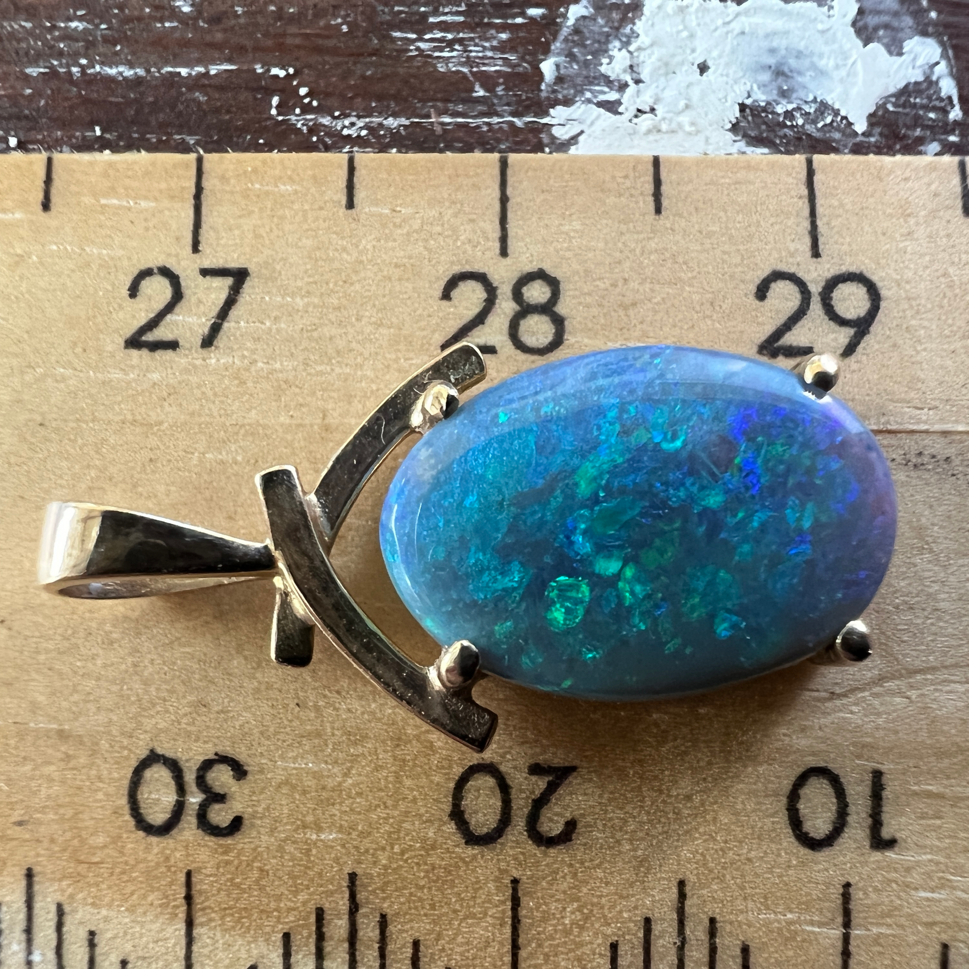 Beautifully cut Lightning Ridge Crystal opal displaying awesome greens. Set in a 14ct gold pendant. Cut and polished by Bill Johnson. Priced to sell.
