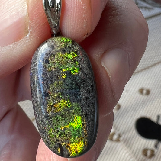 Andamooka Matrix opal pendant. Stunning colours in this lovely stone. Polished beautifully and ready to wear.