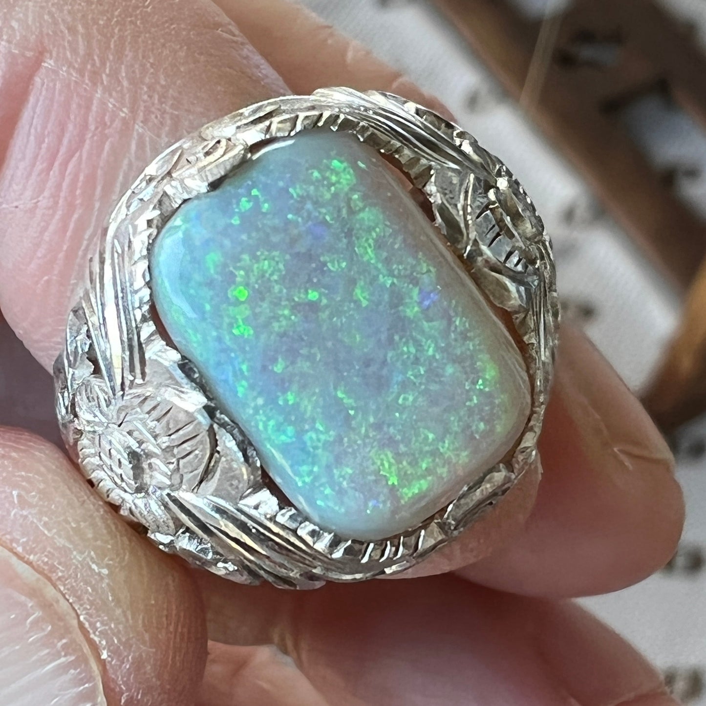 One off perfectly crafted silverwork finished with a beautiful cushion cut Coober Pedy crystal opal showing awesome greens.