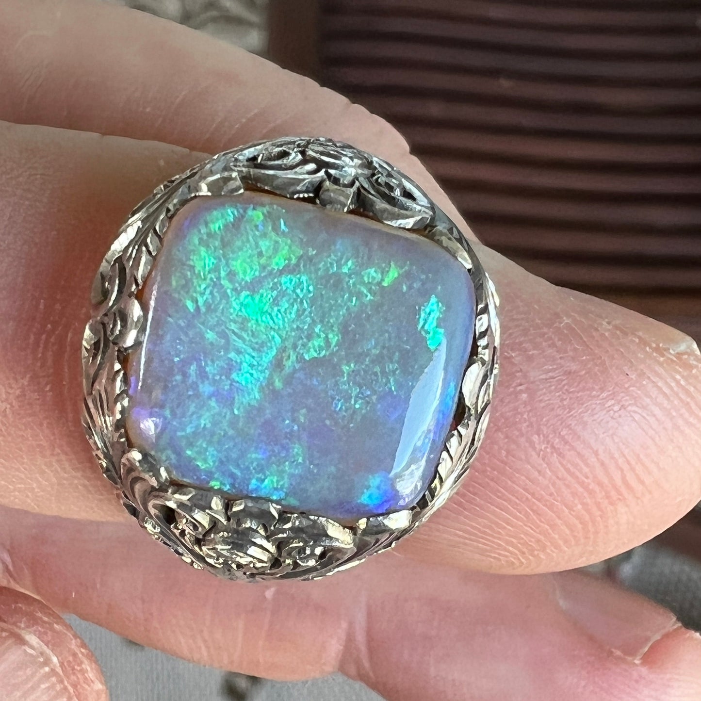 Fantastic one-off silver ring, crafted to show off this awesome Coober Pedy crystal opal. Square cushion cut showing magnificent greens.