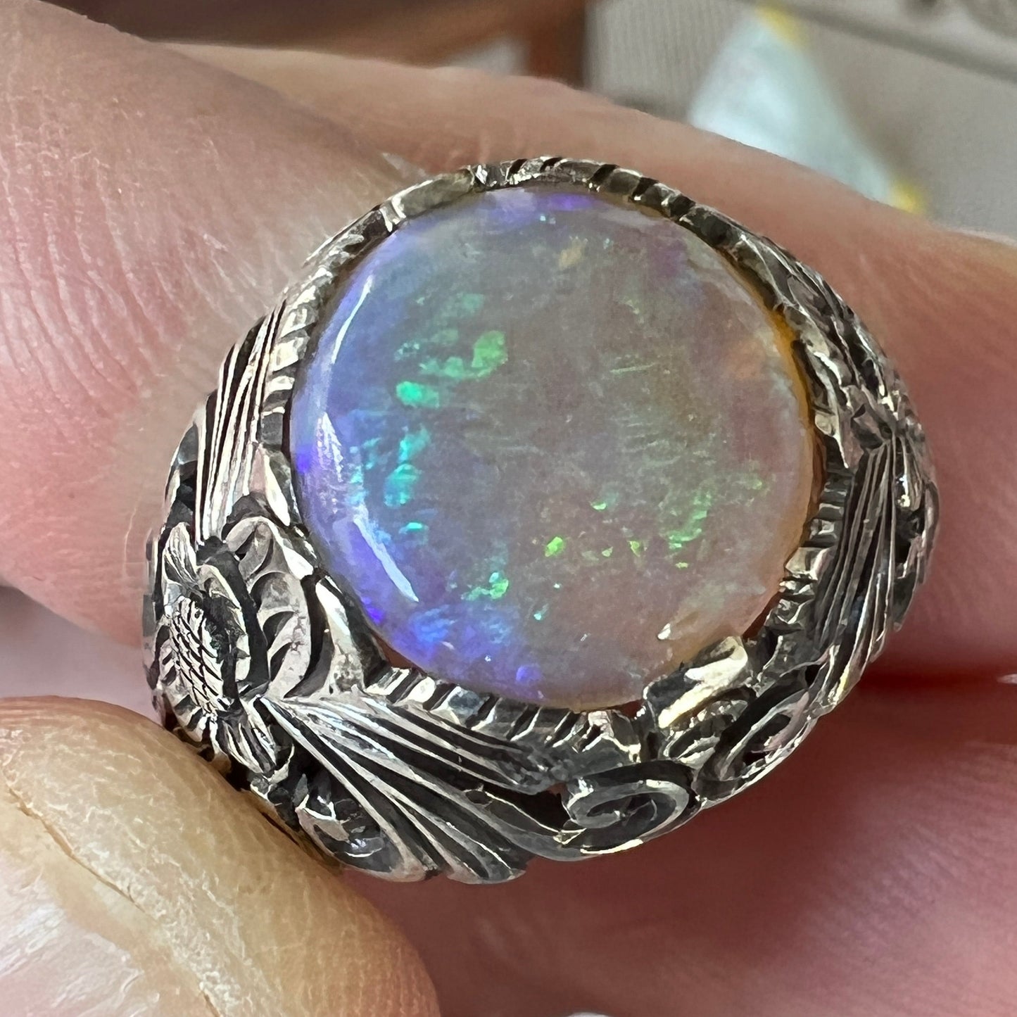 Beautiful one-off bespoke piece showing off a beautiful round cabochon Coober Pedy crystal opal, displaying magnificent greens.