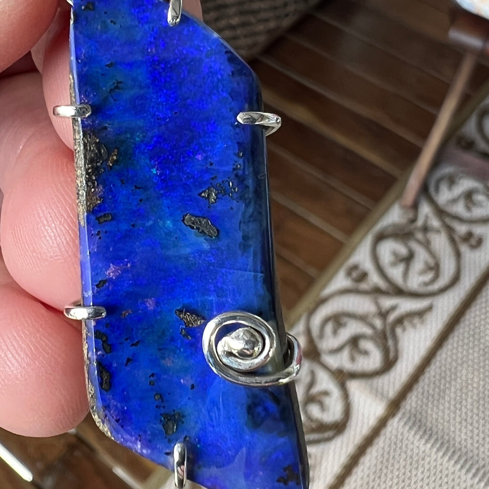 Lovely blue Winton Boulder opal, nicely wire-wrapped in silver. A great piece.
