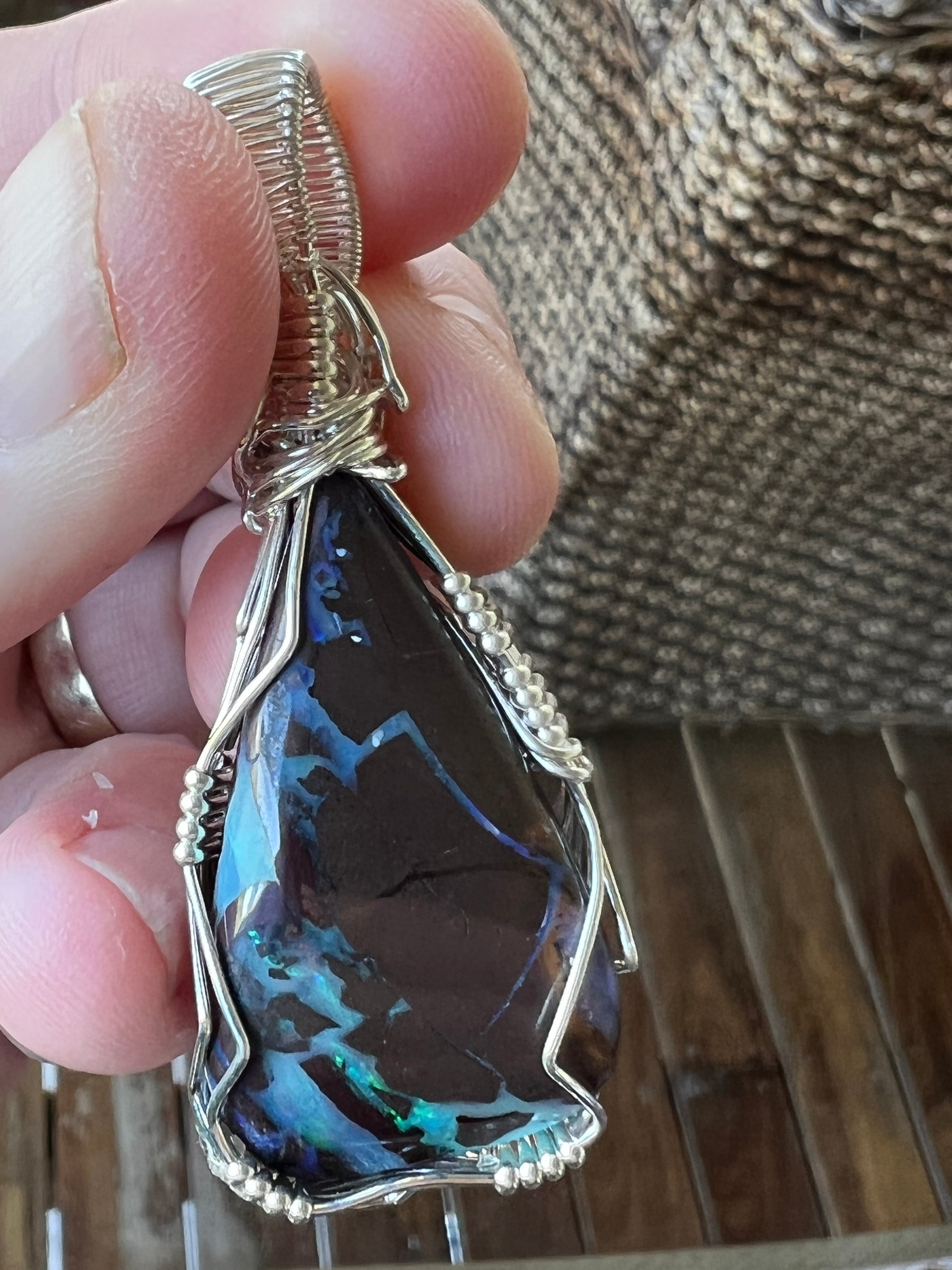 Awesome silver wire wrapped Winton Boulder opal pendant. A great statement piece with lovely colours.
