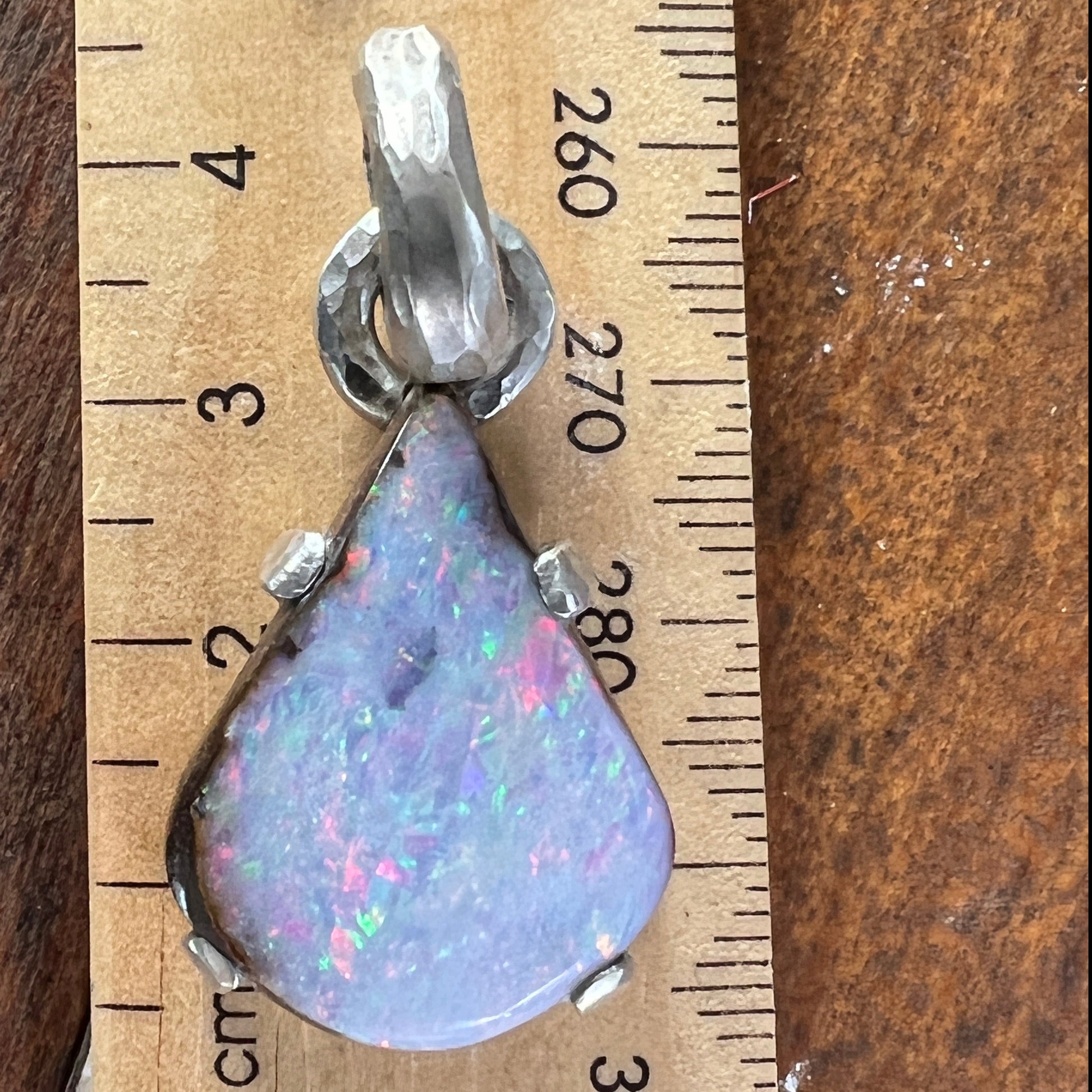 Another beautiful solid opal pendant from the Argentium silver range. Beautiful Queensland Boulder opal showing pinks, blues and greens. Absolutely stunning. 