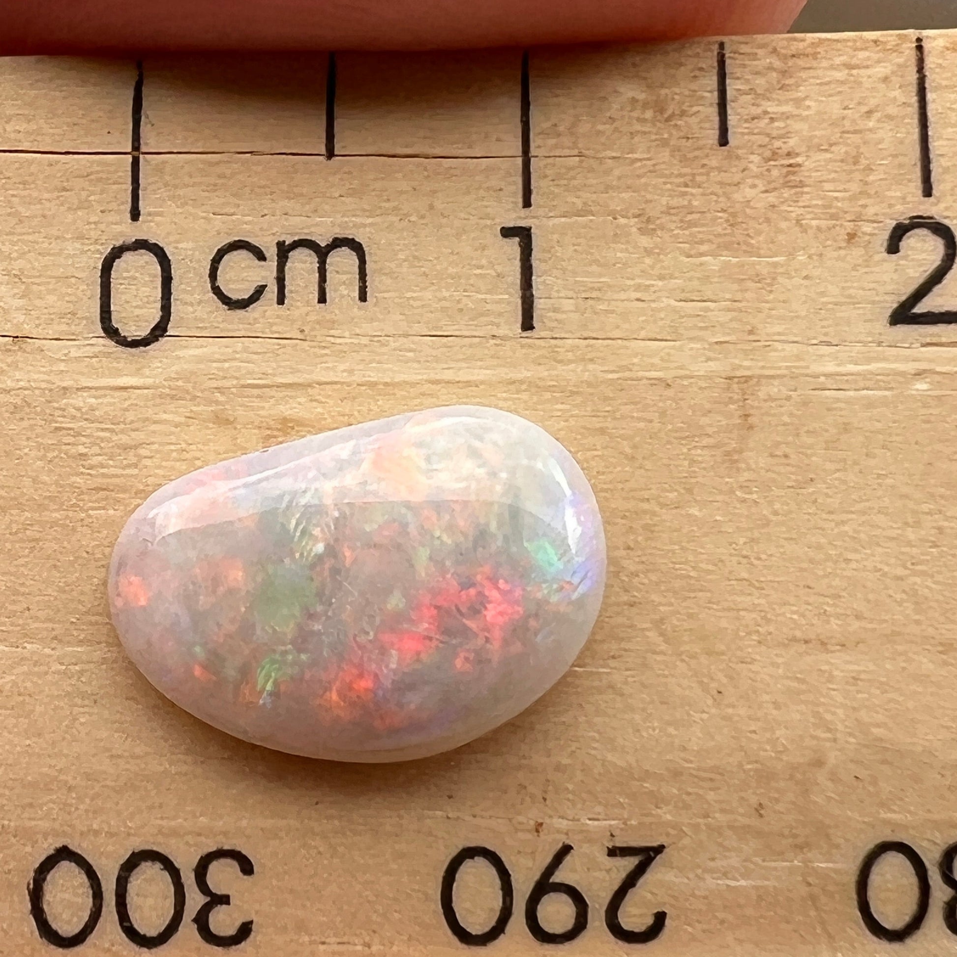 Lightning Ridge solid semi black opal. Awesome play of colours and beautifully polished.