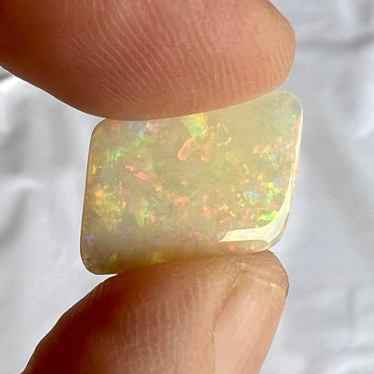 Wonderful Lightning Ridge solid semi black opal, showing all colours. A great shape.