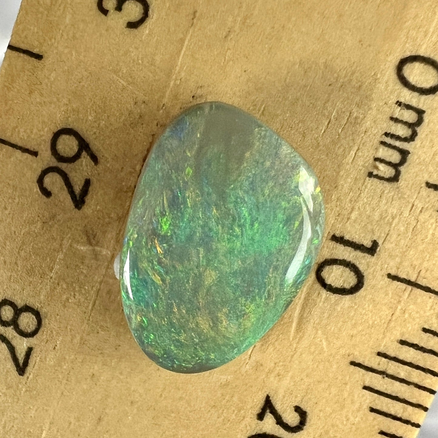 This solid semi black opal from Lightning Ridge displays fantastic colours. Cut, polished, and ready to set.