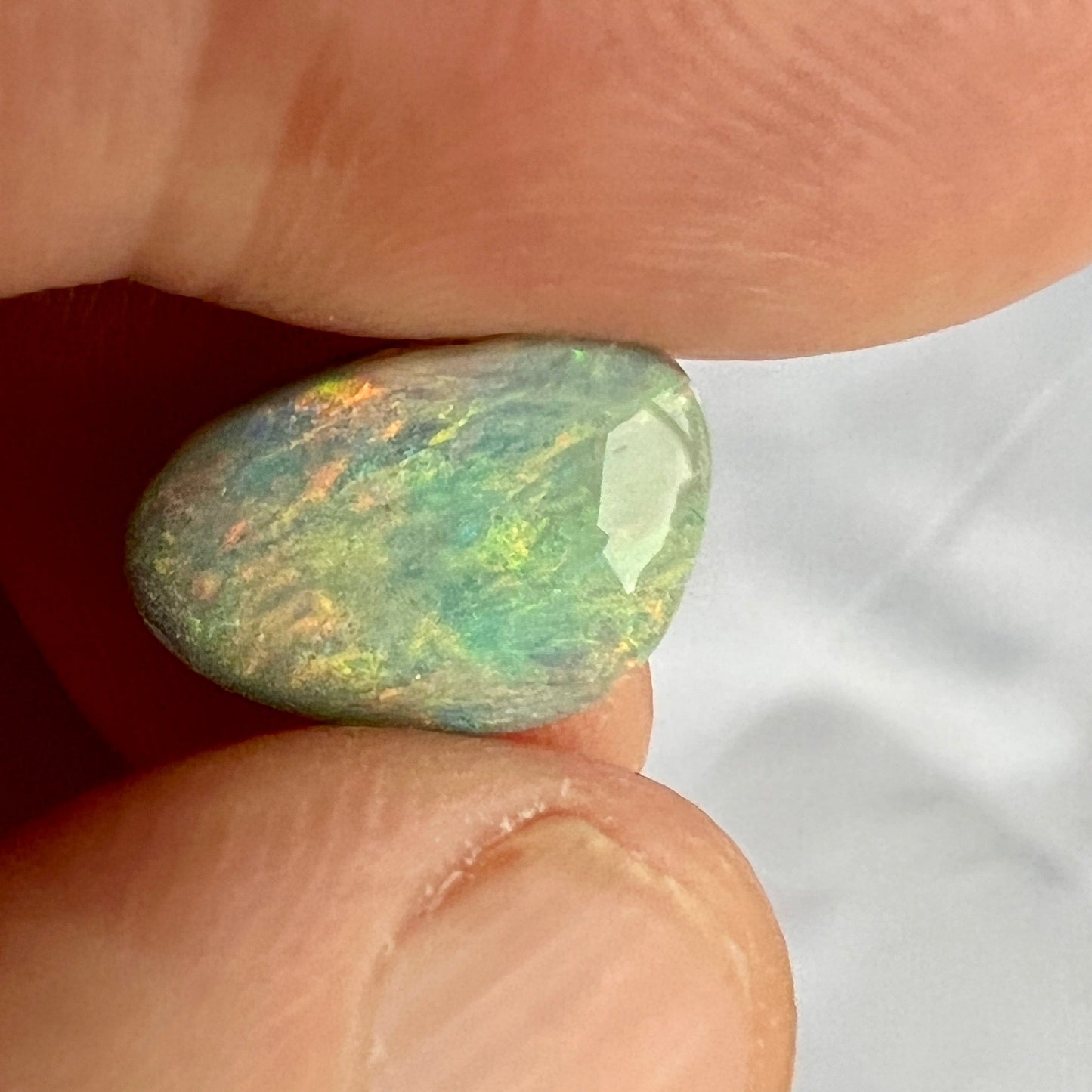 This solid semi black opal from Lightning Ridge displays fantastic colours. Cut, polished, and ready to set.
