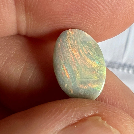 Lightning Ridge solid semi black opal with fantastic pattern and colours. Shaped to perfection.