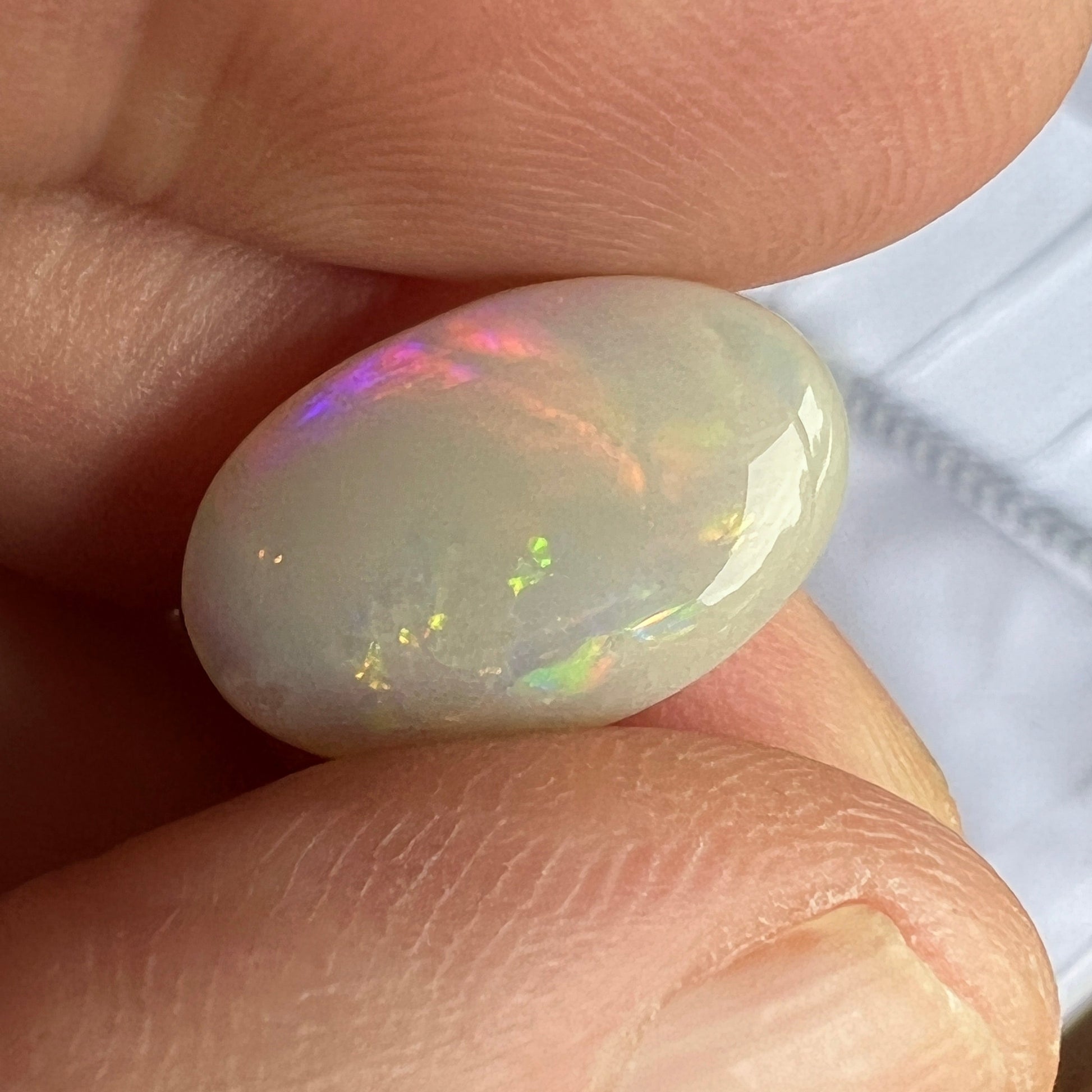 Beautiful rare Mintabie oval solid opal, displaying magnificent purple, blue, green and orange. Ready to set.