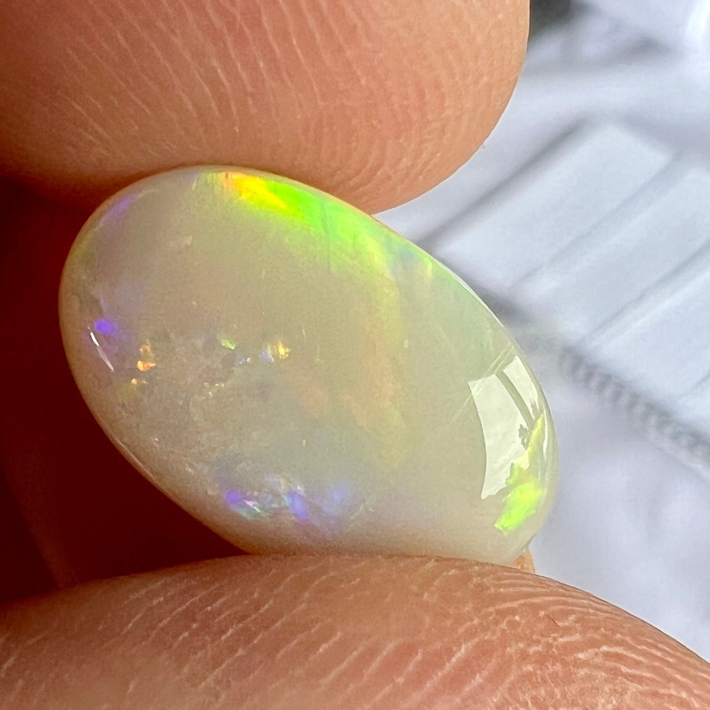 Beautiful rare Mintabie oval solid opal, displaying magnificent purple, blue, green and orange. Ready to set.