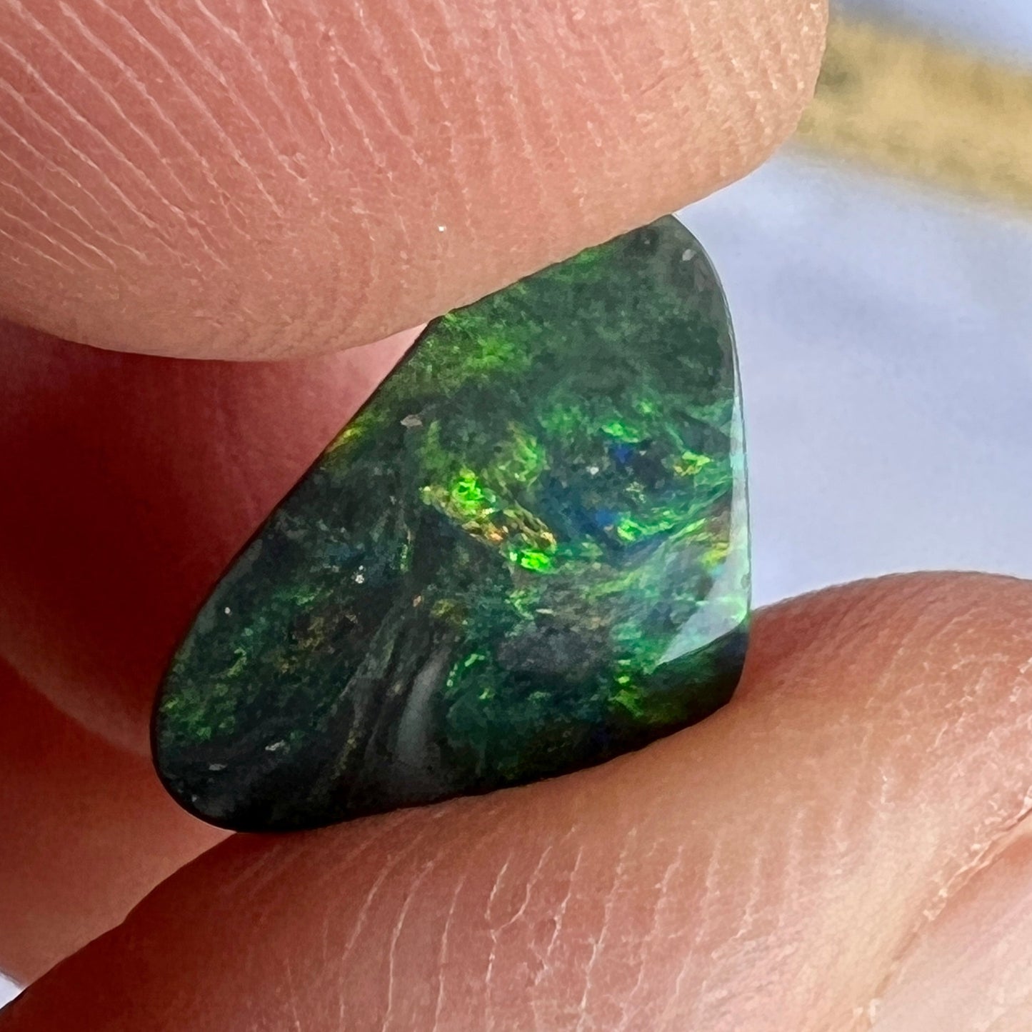Solid black opal from Lightning Ridge with a beautiful play of greens.