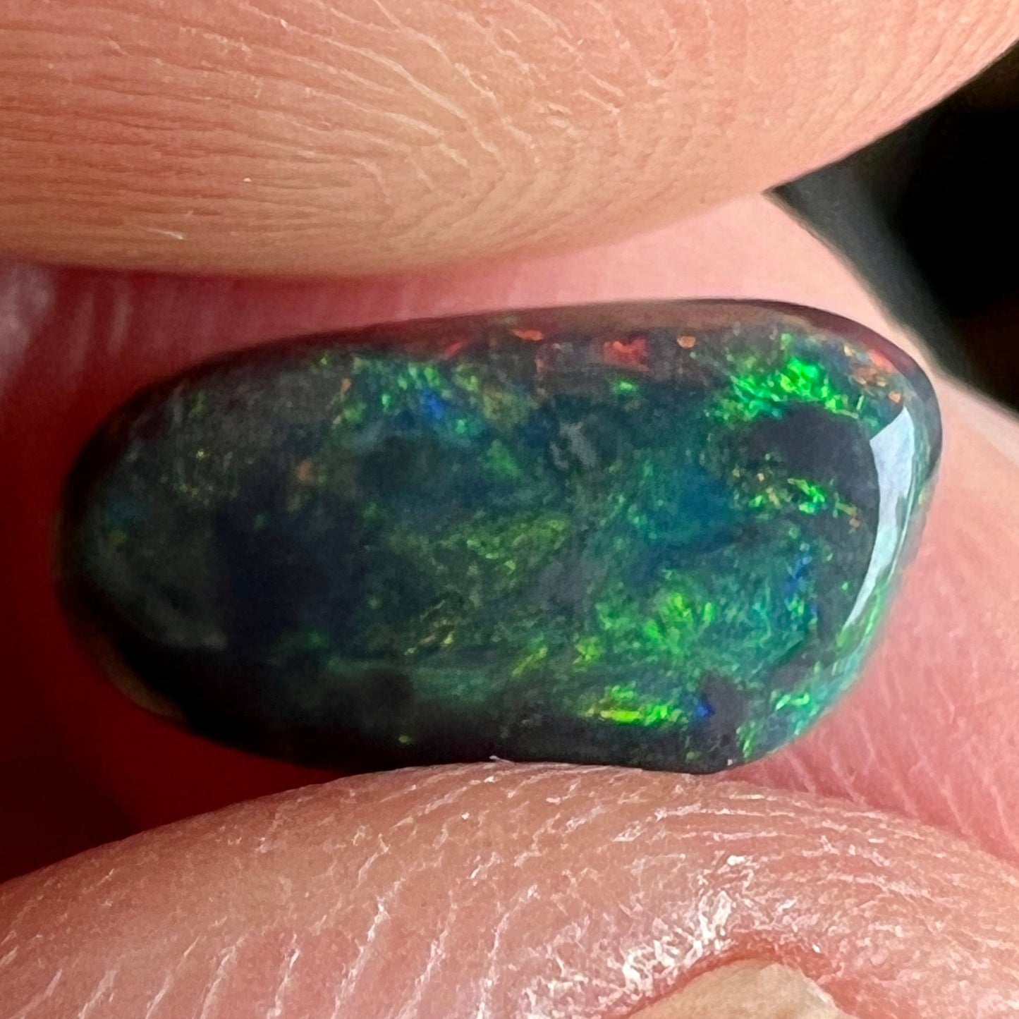 Stunning black opal from the outback opal mines of Lightning Ridge, Beautifully cut and displaying magnificent greens.