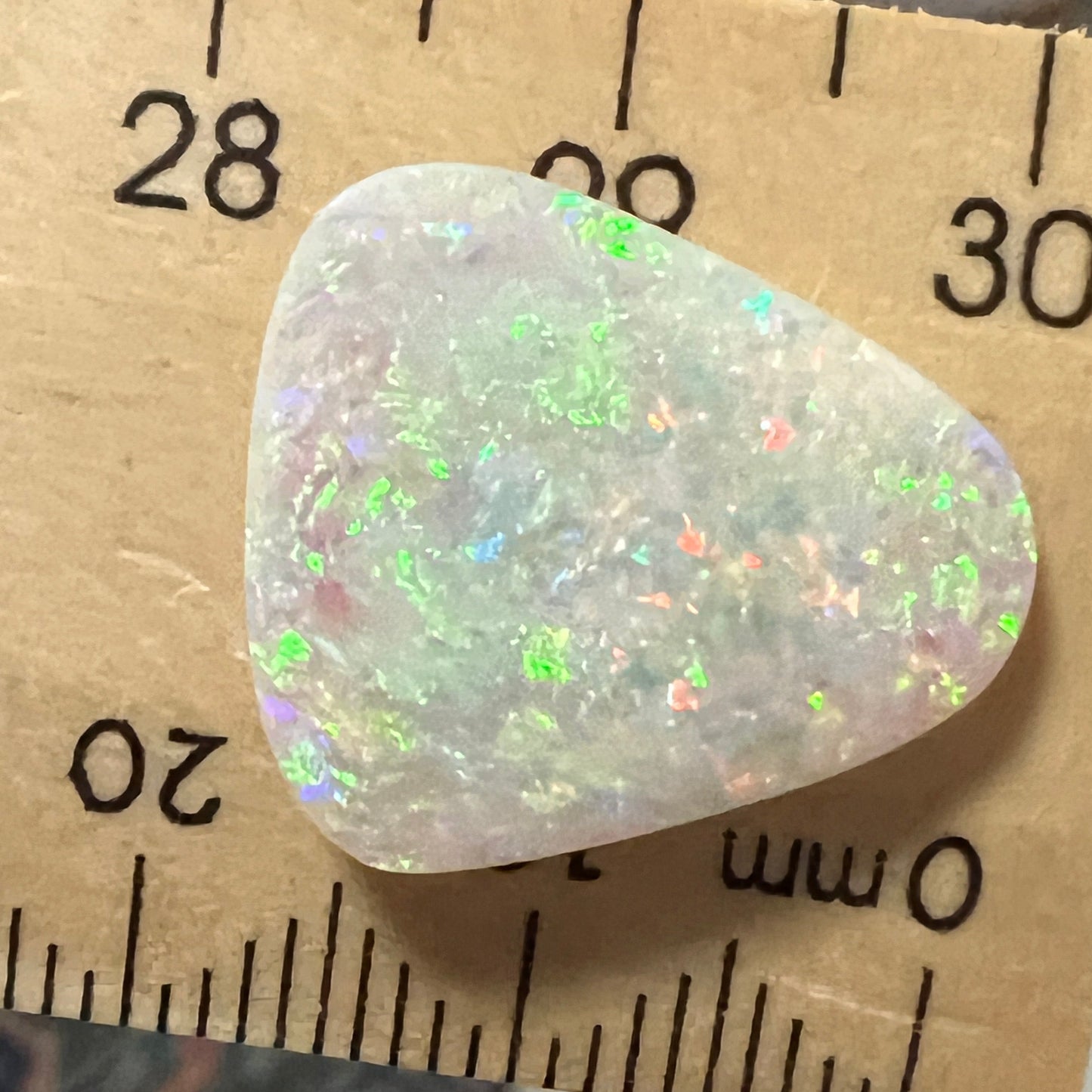 Solid crystal opal from Grawin, near Lightning Ridge. Beautiful greens, and ready to set.