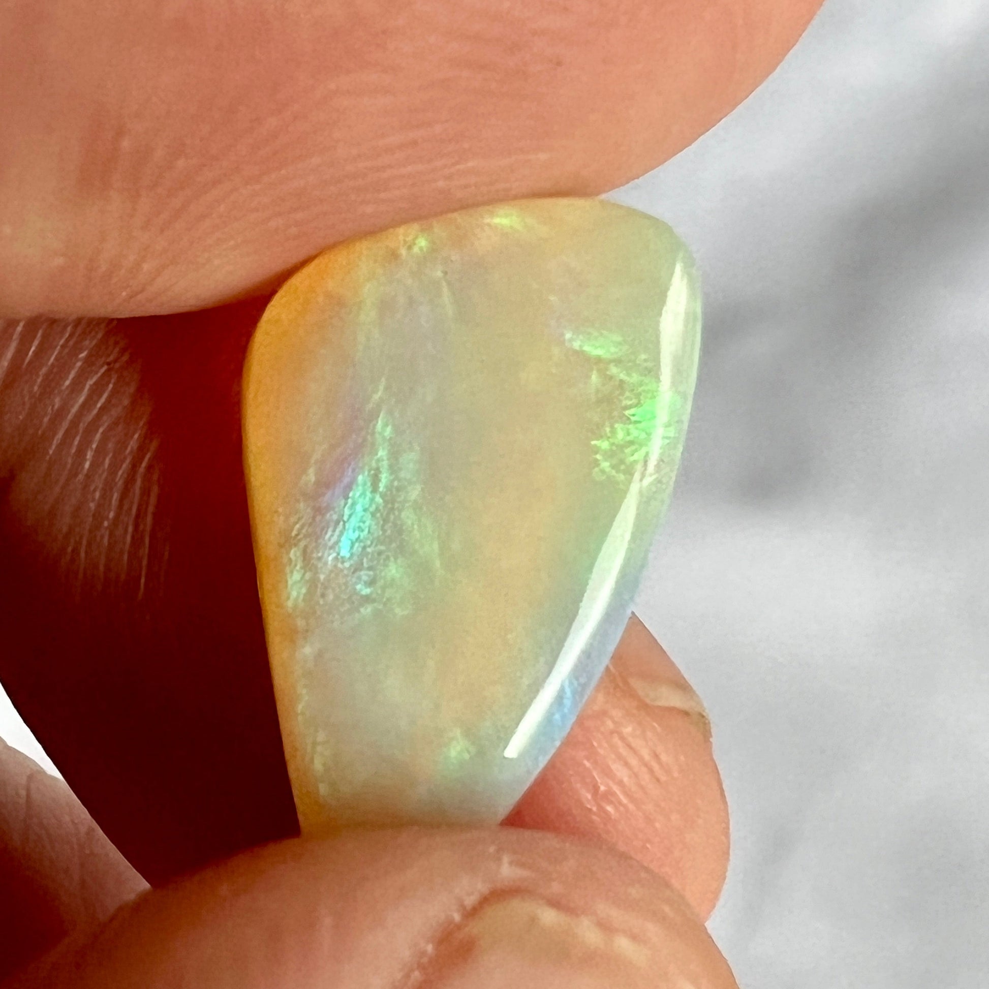 A great example of greens on grey. This Lightning Ridge solid Australian opal is polished to perfection.