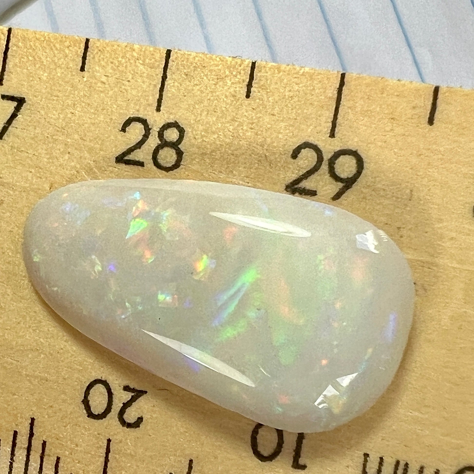 Beautiful Coober Pedy solid opal with iridescent rolling colours. Cut perfectly in a lovely shape.