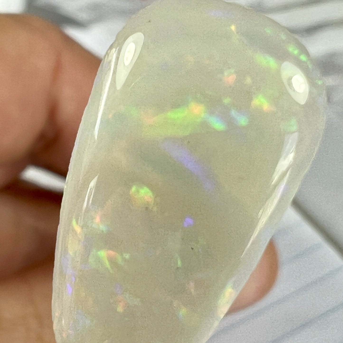Beautiful Coober Pedy solid opal with iridescent rolling colours. Cut perfectly in a lovely shape.