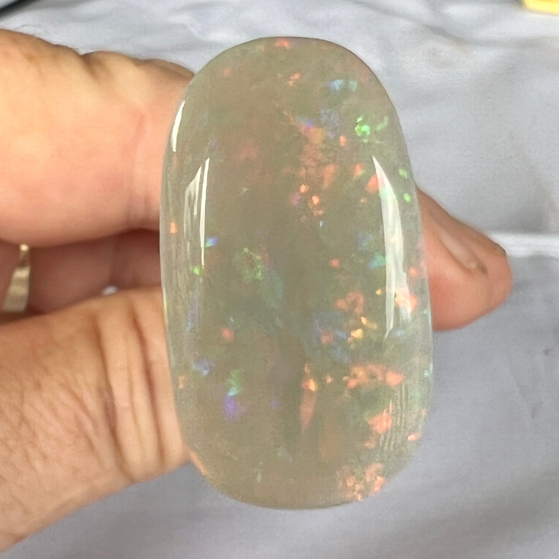 Beautiful array of colour in this solid white opal from Coober Pedy. A nice cut and ready to set.