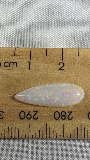 A lovely teardrop cut 2.5ct solid white Coober Pedy opal. A great example, cut by Bill Johnson.