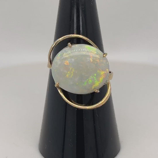 Beautiful one-off ring. Wonderful colours in this 4.8ct solid Coober Pedy opal. Set in 14ct gold.
