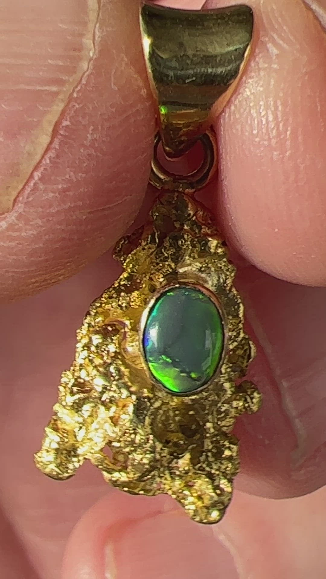 Pure solid gold nugget pendant from Western Australia. Perfectly set and balanced with an 18ct bale. Set with a beautifully cut black opal from Lightning Ridge.