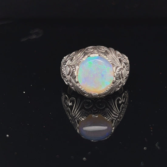 Beautiful one-off bespoke piece showing off a beautiful round cabochon Coober Pedy crystal opal, displaying magnificent greens.