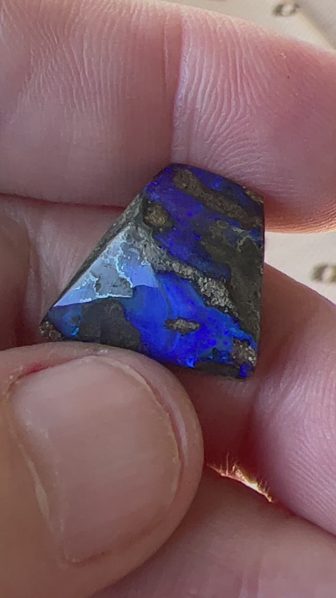 An unusual shaped piece of boulder opal with stunning blues throughout. 