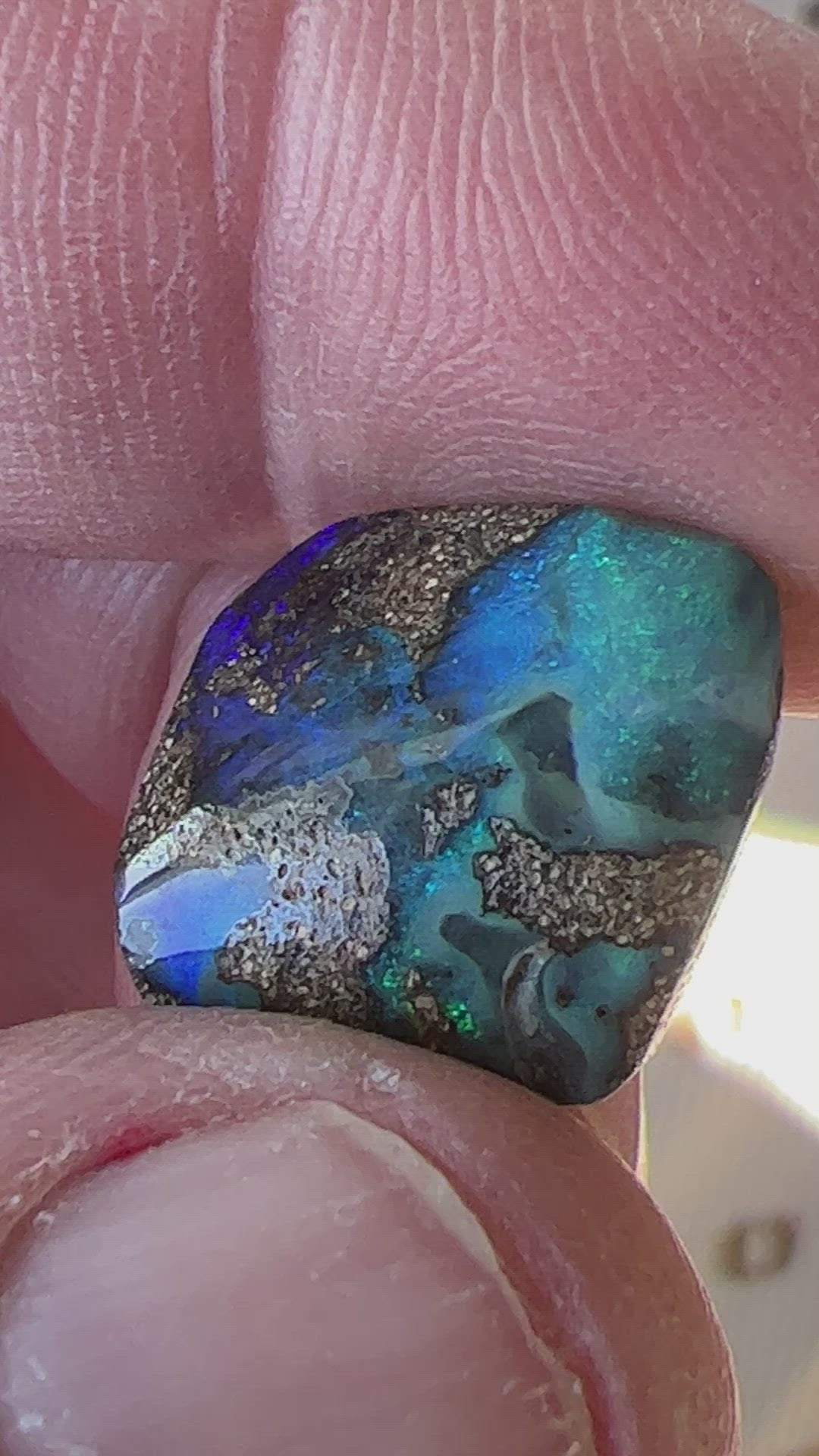 Beautiful greens and blues are displayed in this nice piece of Queensland boulder opal.