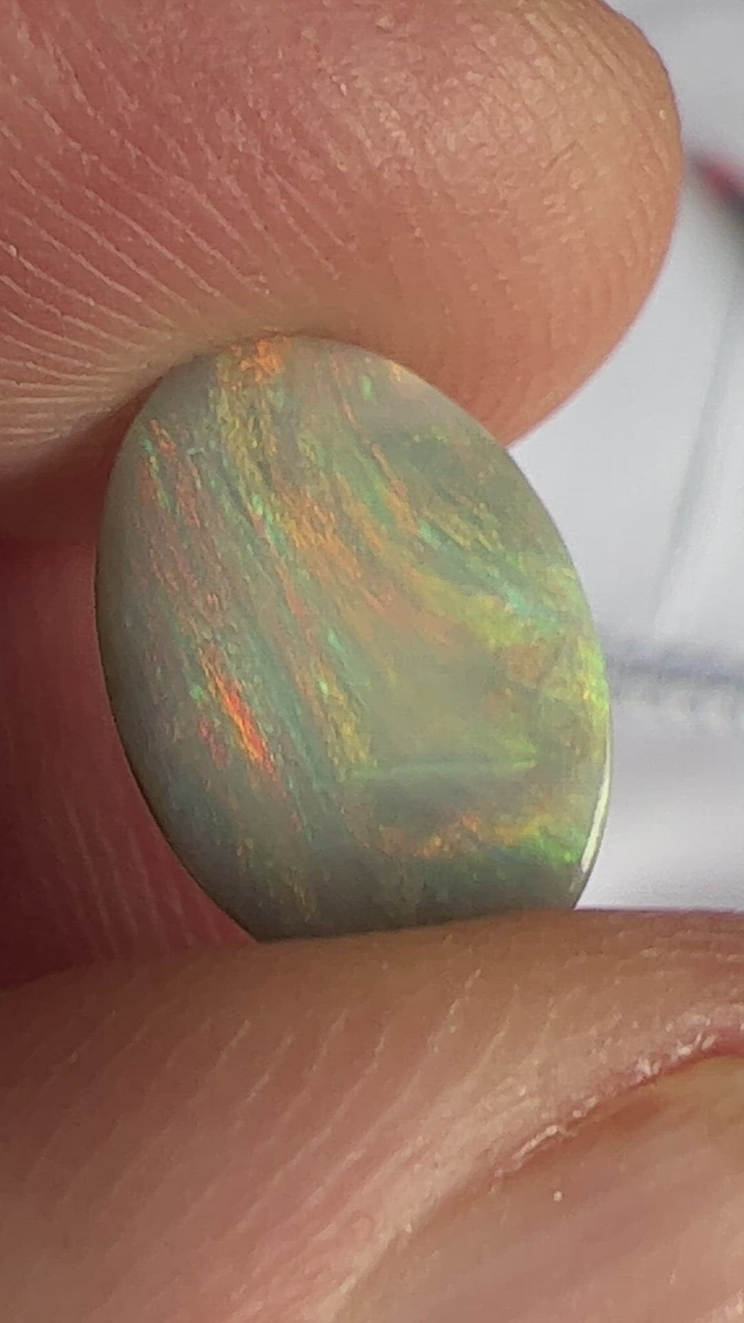 Lightning Ridge solid semi black opal with fantastic pattern and colours. Shaped to perfection.