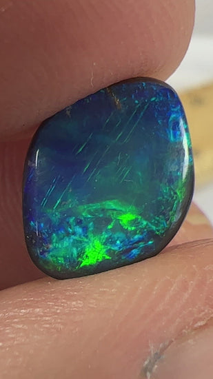 Blue black solid opal from Lightning Ridge. Beautiful patterns and colours.