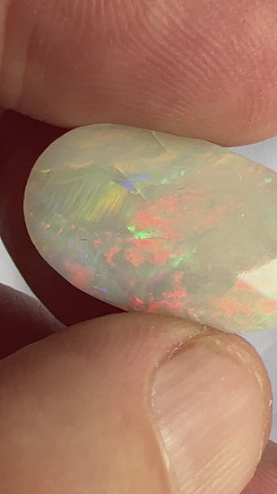Beautiful large solid opal from Grawin near Lightning Ridge. Great shape and awesome colours. Very small and not noticeable to the eye settled crack, hence price.