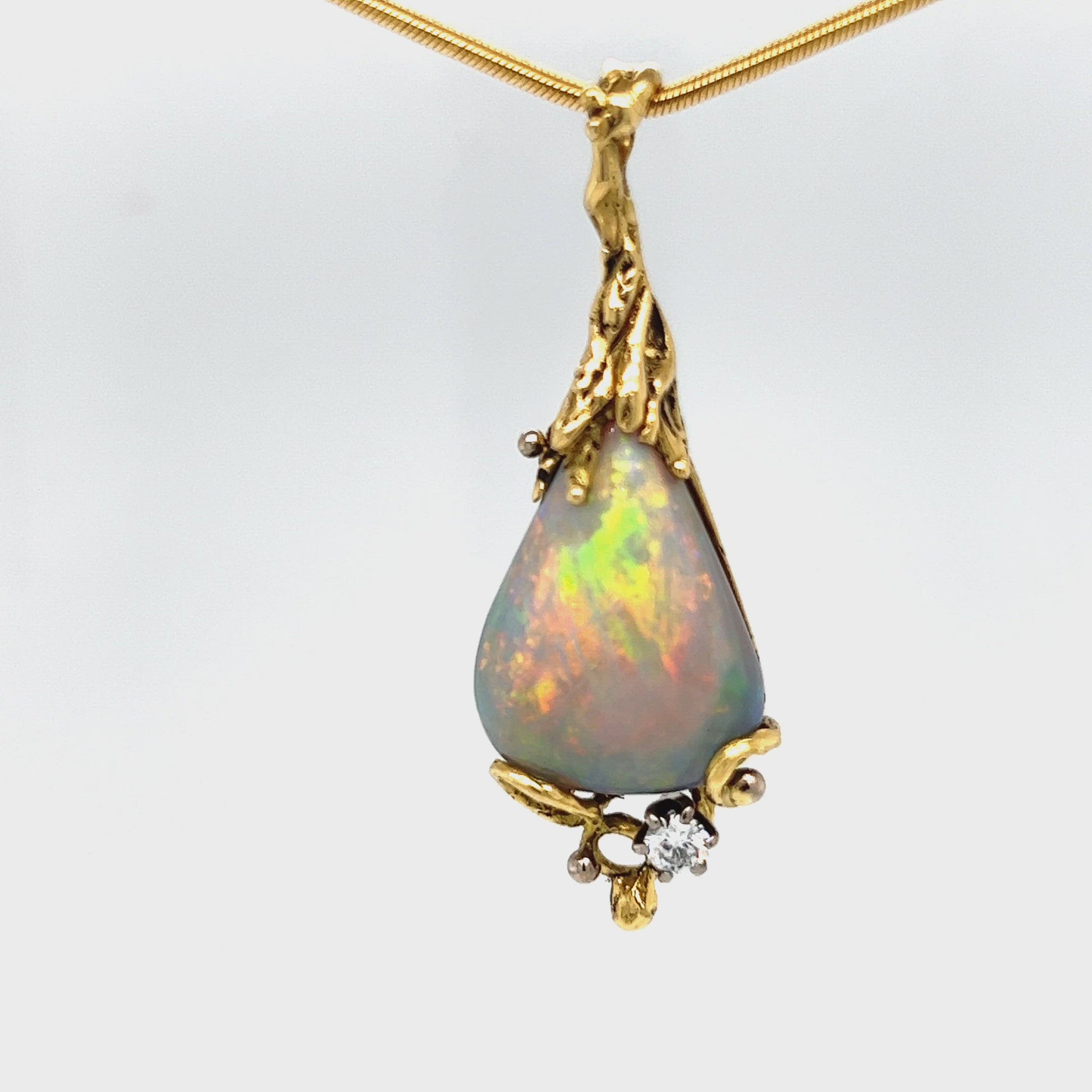 Stunning pendant hand made by Sally Fisher. Beautiful 8.5ct Lightning Ridge black opal mined 25-30 metres below what is now the 'Black Opal Motel'. Moulded 18ct gold  finished off with a brilliant cut diamond.  A masterpiece.